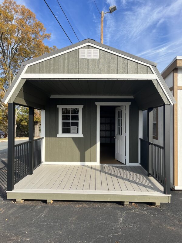 Lofted Shed Green with white trim. 8 Foot front porch.