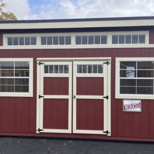 Modern shed red with white trim. Two windows, one on each side