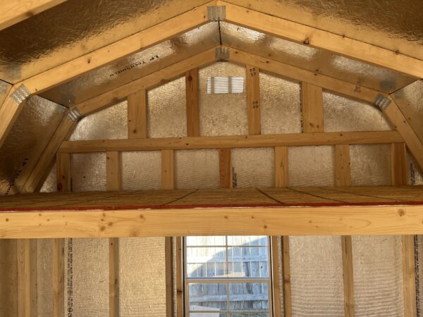 Interior photo of 10 x 16 lofted shed with loft in the back