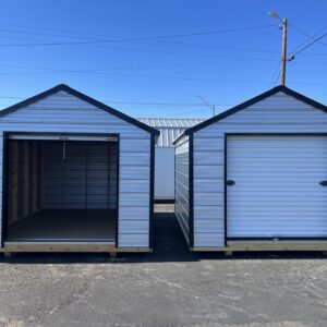 Two 10 x 12 Metal Buildings sitting side by side. One with the roll up door open and one with the door closed.